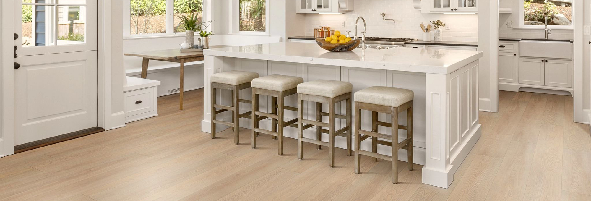 white kitchen island with brown vinyl floor from Michaels Carpets Huntington Beach in Huntington Beach, CA
